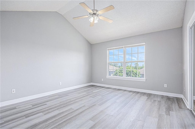 902 SW Peach Tree Ln, Blue Springs, MO 64064 - spare room featuring a ceiling fan, light wood finished floors, and vaulted ceiling