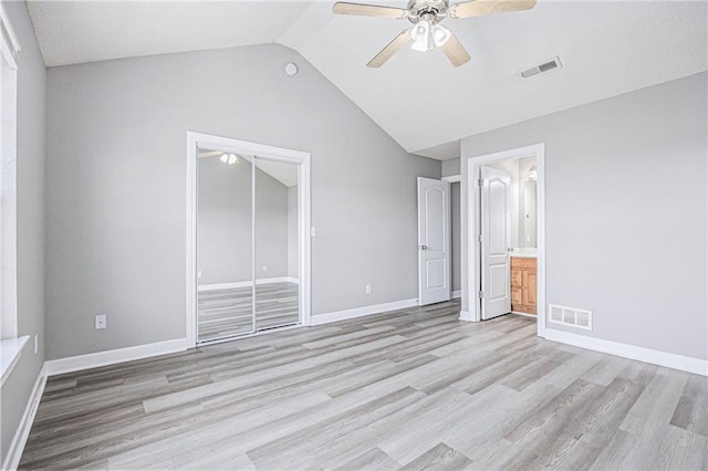 902 SW Peach Tree Ln, Blue Springs, MO 64064 - unfurnished bedroom featuring light wood-style flooring, vaulted ceiling, a ceiling fan, and ensuite bathroom