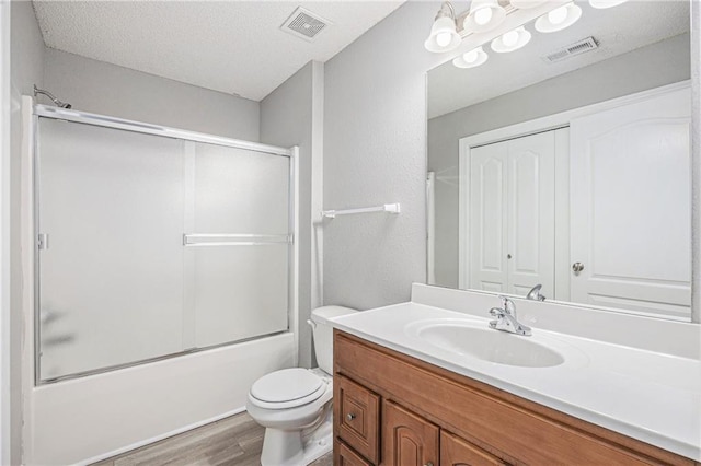 902 SW Peach Tree Ln, Blue Springs, MO 64064 - full bath with vanity, wood finished floors, and enclosed tub / shower combo