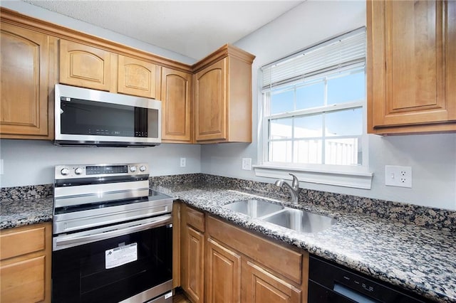 904 SW Peach Tree Ln, Blue Springs, MO 64064 - kitchen with appliances with stainless steel finishes and stone countertops