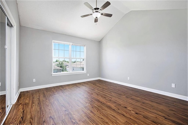 904 SW Peach Tree Ln, Blue Springs, MO 64064 - unfurnished bedroom with dark wood-style flooring, lofted ceiling, and ceiling fan