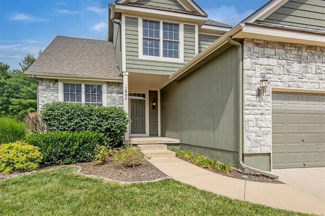 895 N Diane Dr, Olathe, KS 66061 - view of front of home with stone siding, a garage, and roof with shingles
