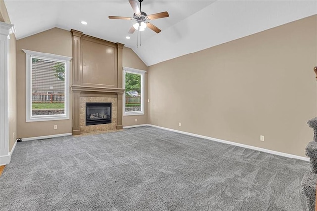 895 N Diane Dr, Olathe, KS 66061 - unfurnished living room with a ceiling fan, vaulted ceiling, a tile fireplace, carpet, and recessed lighting