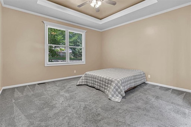 895 N Diane Dr, Olathe, KS 66061 - bedroom featuring a tray ceiling, crown molding, carpet, and a ceiling fan