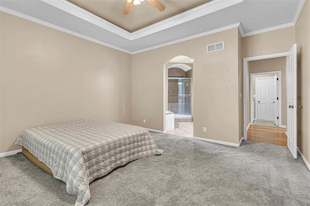 895 N Diane Dr, Olathe, KS 66061 - bedroom with arched walkways, ornamental molding, a tray ceiling, carpet floors, and a ceiling fan