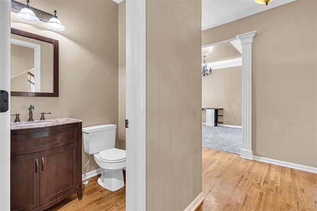 895 N Diane Dr, Olathe, KS 66061 - half bath featuring vanity and wood finished floors