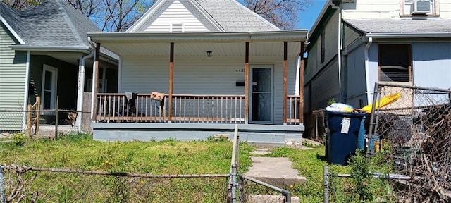 4432 E 10th St, Kansas City, MO 64127 - view of front of property with a porch and roof with shingles
