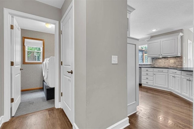 14440 W 187th Ter, Olathe, KS 66062 - hall featuring dark wood-type flooring and a textured ceiling