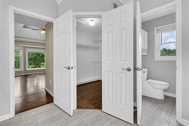 14440 W 187th Ter, Olathe, KS 66062 - bathroom featuring ceiling fan, plenty of natural light, and crown molding