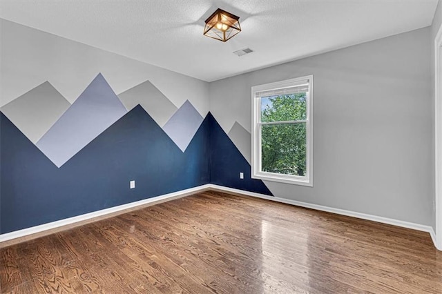 14440 W 187th Ter, Olathe, KS 66062 - empty room with wood finished floors and baseboards