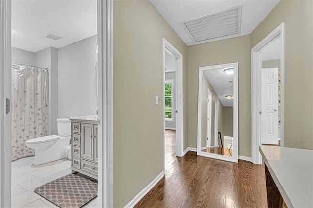 14440 W 187th Ter, Olathe, KS 66062 - bathroom with wood finished floors, vanity, and a shower with shower curtain