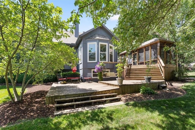 14440 W 187th Ter, Olathe, KS 66062 - rear view of house with a sunroom, a deck, stairs, and a yard