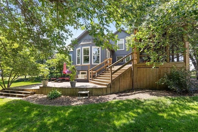 14440 W 187th Ter, Olathe, KS 66062 - back of property featuring a deck, stairway, and a yard