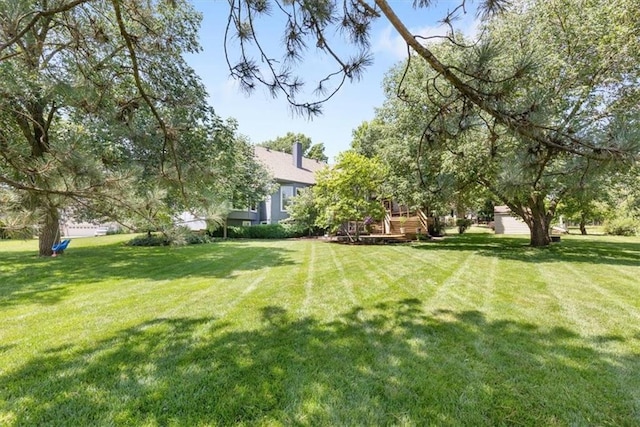 14440 W 187th Ter, Olathe, KS 66062 - view of green lawn featuring a wooden deck