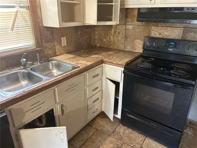 7615 E 48th St, Kansas City, MO 64129 - kitchen with black electric range, under cabinet range hood, backsplash, and white cabinets