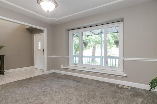 1503 Wrangler Way, Raymore, MO 64083 - empty room featuring light carpet and light tile patterned flooring