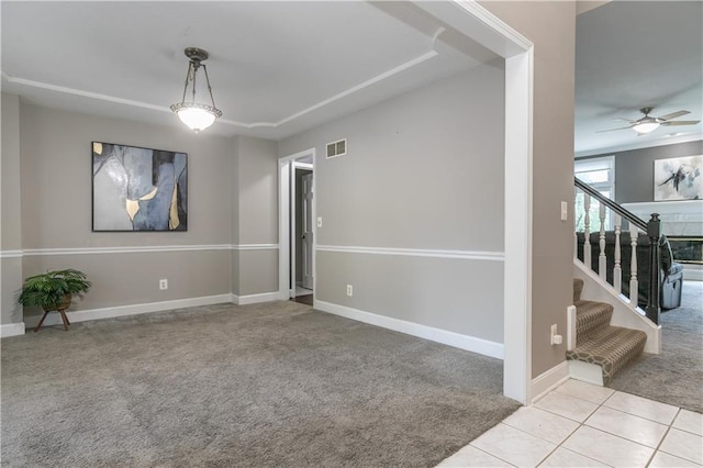 1503 Wrangler Way, Raymore, MO 64083 - carpeted spare room with stairs and ceiling fan