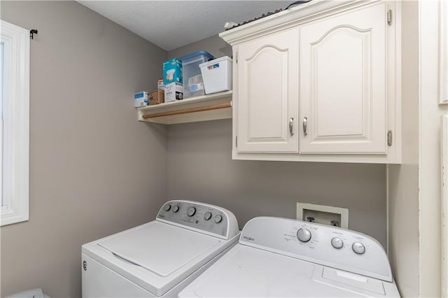 1503 Wrangler Way, Raymore, MO 64083 - laundry area featuring independent washer and dryer, cabinet space, and a textured ceiling