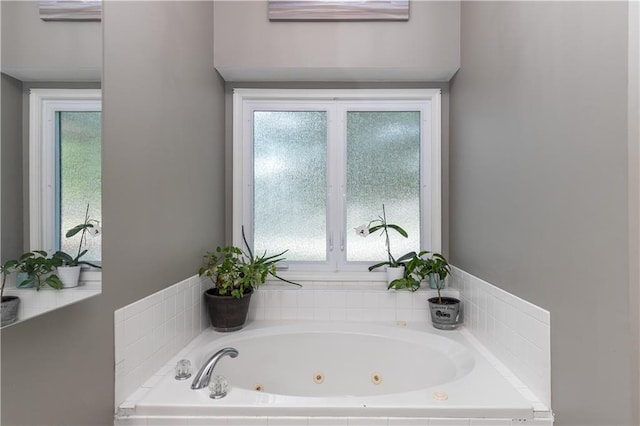 1503 Wrangler Way, Raymore, MO 64083 - bathroom featuring a tub with jets