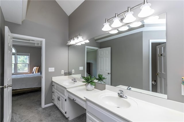 1503 Wrangler Way, Raymore, MO 64083 - ensuite bathroom featuring double vanity, a chandelier, and vaulted ceiling