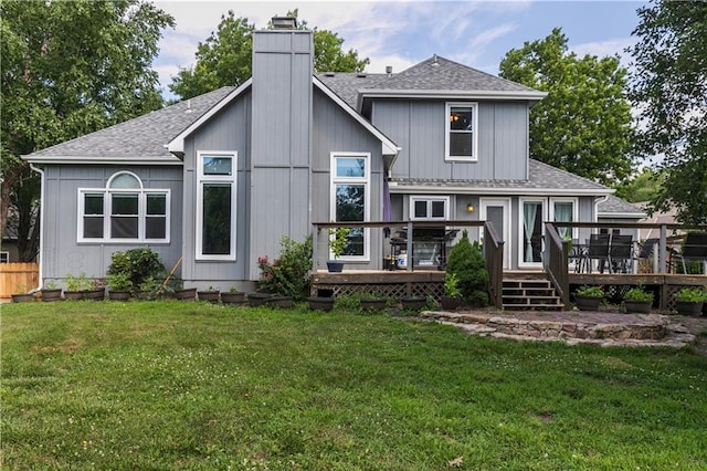 1503 Wrangler Way, Raymore, MO 64083 - back of house featuring a shingled roof, a deck, and a chimney
