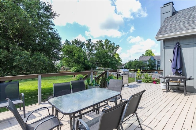 1503 Wrangler Way, Raymore, MO 64083 - wooden terrace with outdoor dining space and a yard