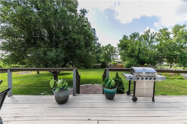 1503 Wrangler Way, Raymore, MO 64083 - wooden terrace featuring grilling area and a lawn
