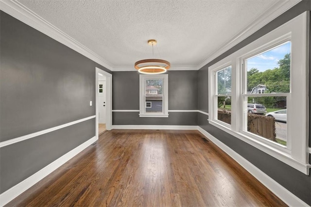 5900 Cherry St, Kansas City, MO 64110 - unfurnished dining area featuring a textured ceiling, dark wood-type flooring, and crown molding