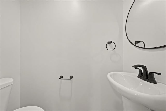 5900 Cherry St, Kansas City, MO 64110 - bathroom with a sink and toilet