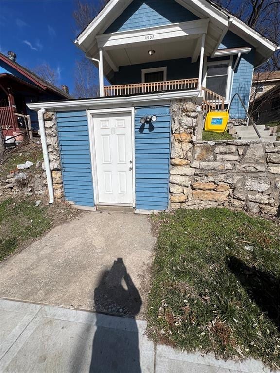 4902 E 17th St, Kansas City, MO 64127 - view of exterior entry featuring stone siding