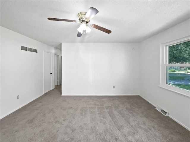 17604 E 19th Street Ct, Independence, MO 64057 - carpeted spare room with a ceiling fan and a textured ceiling