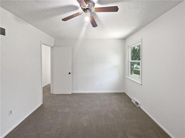 17604 E 19th Street Ct, Independence, MO 64057 - spare room featuring a textured ceiling, ceiling fan, and dark carpet
