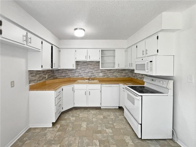 17604 E 19th Street Ct, Independence, MO 64057 - kitchen featuring white appliances, decorative backsplash, a textured ceiling, stone finish flooring, and open shelves