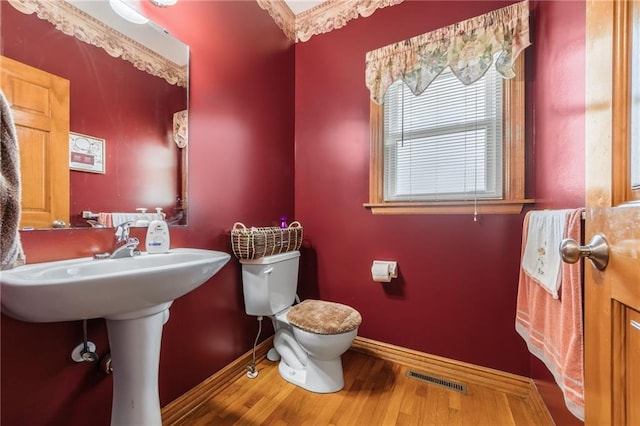 4000 SW Boulder Dr, Lees Summit, MO 64082 - bathroom with wood finished floors and toilet