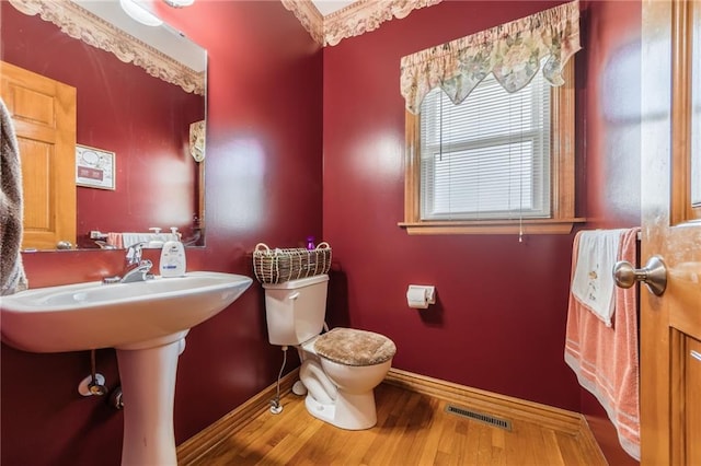 4000 SW Boulder Dr, Lees Summit, MO 64082 - half bath with wood finished floors and toilet
