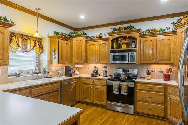 4000 SW Boulder Dr, Lees Summit, MO 64082 - kitchen with appliances with stainless steel finishes, light countertops, brown cabinets, ornamental molding, and backsplash