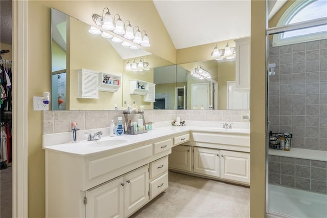 4000 SW Boulder Dr, Lees Summit, MO 64082 - bathroom with double vanity, vaulted ceiling, a stall shower, a walk in closet, and tasteful backsplash