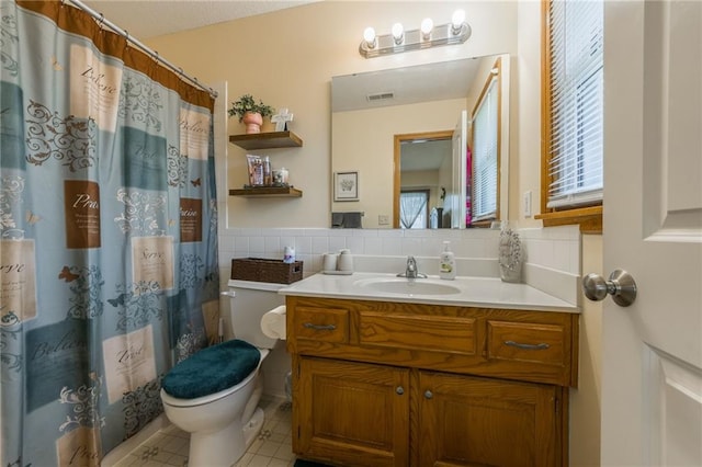 4000 SW Boulder Dr, Lees Summit, MO 64082 - bathroom with vanity, healthy amount of natural light, tile patterned flooring, and a shower with curtain