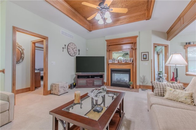 22604 Vincent St, Peculiar, MO 64078 - carpeted living area featuring a raised ceiling, ceiling fan, and a large fireplace