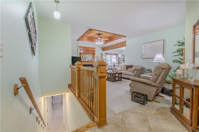 22604 Vincent St, Peculiar, MO 64078 - living room featuring a tray ceiling, a ceiling fan, and light colored carpet