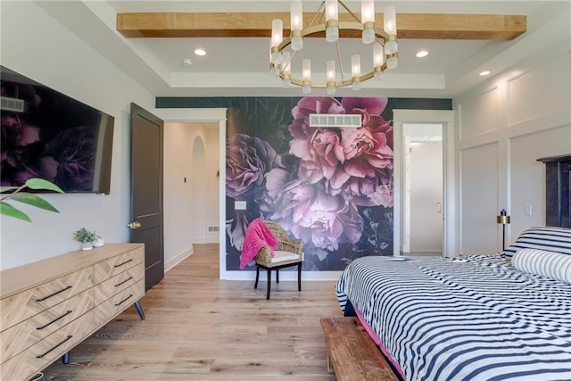 17325 Bradshaw St, Overland Park, KS 66221 - bedroom featuring a chandelier, light wood-type flooring, recessed lighting, an accent wall, and a tray ceiling