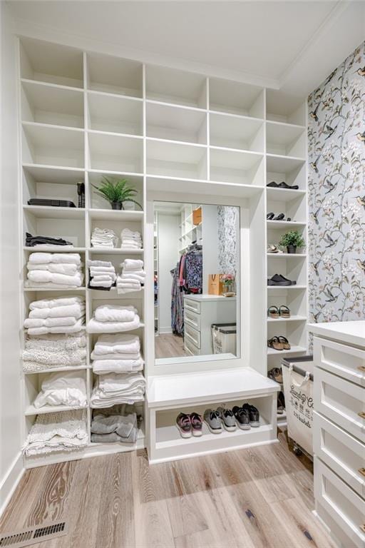 17325 Bradshaw St, Overland Park, KS 66221 - mudroom with wallpapered walls and wood finished floors