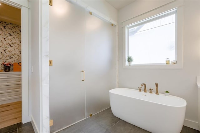 17325 Bradshaw St, Overland Park, KS 66221 - full bathroom with a freestanding bath and tile patterned floors