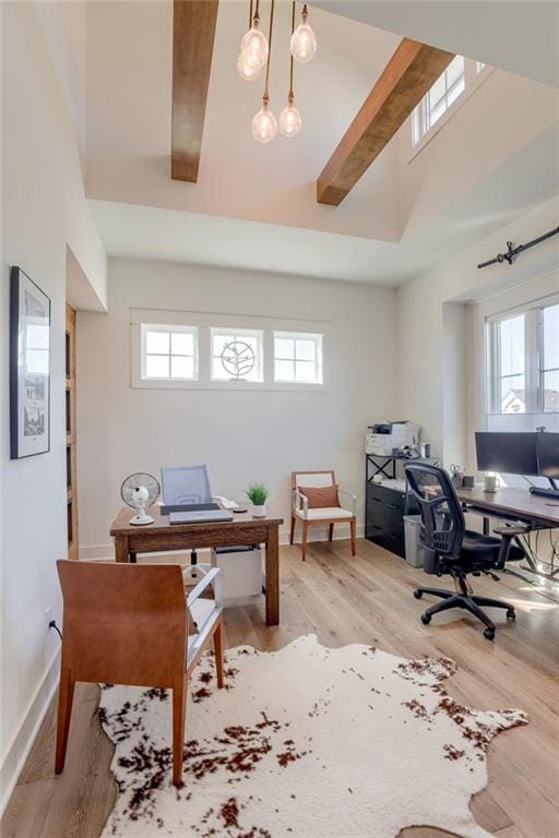 17325 Bradshaw St, Overland Park, KS 66221 - home office with wood finished floors, plenty of natural light, and beamed ceiling