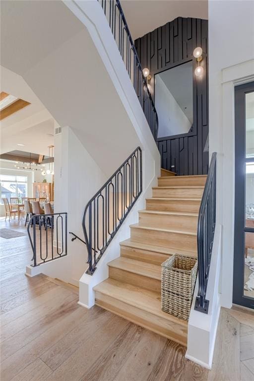 17325 Bradshaw St, Overland Park, KS 66221 - staircase featuring wood finished floors