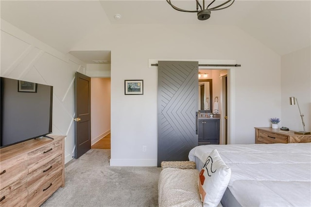 17325 Bradshaw St, Overland Park, KS 66221 - bedroom with vaulted ceiling, light carpet, and connected bathroom