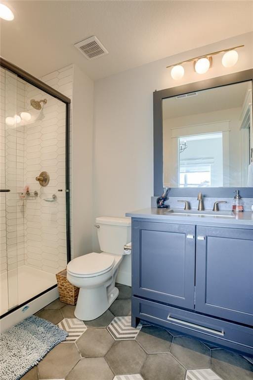 17325 Bradshaw St, Overland Park, KS 66221 - bathroom featuring vanity, a shower stall, tile patterned flooring, and a baseboard radiator