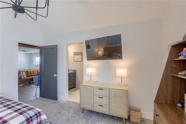 17325 Bradshaw St, Overland Park, KS 66221 - bedroom with light carpet, lofted ceiling, and ensuite bath