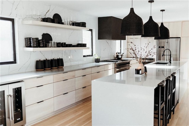 5500 Mission Rd, Fairway, KS 66205 - kitchen with open shelves, modern cabinets, wine cooler, stainless steel appliances, and exhaust hood