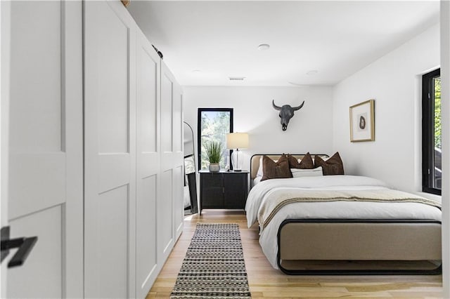 5500 Mission Rd, Fairway, KS 66205 - bedroom featuring light wood-style floors